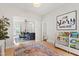 Inviting living area featuring hardwood floors, stylish furnishings, and direct view into the play area at 8613 Swarthmore Dr, Raleigh, NC 27615