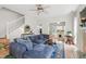 Spacious living room with a cozy sectional couch and ample natural light at 8613 Swarthmore Dr, Raleigh, NC 27615