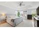 Serene main bedroom featuring a tray ceiling, soft color palette, and plenty of natural light at 8613 Swarthmore Dr, Raleigh, NC 27615