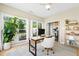 Well-lit home office space featuring a modern desk, comfortable chair, and views of the outdoor scenery at 8613 Swarthmore Dr, Raleigh, NC 27615