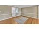 Bright bedroom featuring hardwood floors and a neutral color palette, with a cozy rug at 917 Saint Marys St, Raleigh, NC 27605