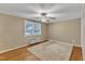 Bedroom with hardwood floors, ceiling fan, window with blinds, and air conditioner at 917 Saint Marys St, Raleigh, NC 27605