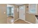 Small kitchen area showing linoleum floor, a white door and transition into dining area at 917 Saint Marys St, Raleigh, NC 27605