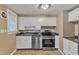 Functional kitchen featuring white cabinetry and stainless steel appliances at 917 Saint Marys St, Raleigh, NC 27605