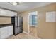 Well-lit kitchen with white cabinets, stainless steel appliances, and views into the dining area at 917 Saint Marys St, Raleigh, NC 27605