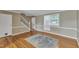 Inviting living room with hardwood floors, neutral walls, and staircase leading to the next level at 917 Saint Marys St, Raleigh, NC 27605