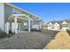 Well-maintained backyard showcases the rear exteriors and covered patios of neighboring properties at 919 Montague Ave, Durham, NC 27703