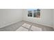 Bedroom shows a window, carpet, and base trim at 919 Montague Ave, Durham, NC 27703