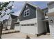 New construction townhome shows siding, garage, front door, and driveway at 919 Montague Ave, Durham, NC 27703