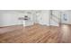 Living room shows windows, sliding doors, stairs, and kitchen with island at 919 Montague Ave, Durham, NC 27703