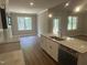Bright and airy kitchen with white cabinets, granite countertops, modern appliances, and ample space for entertaining at 9254 Turkey Way, Middlesex, NC 27557