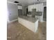 Kitchen featuring a large island, stone countertops, white cabinets, and stainless steel fixtures at 9254 Turkey Way, Middlesex, NC 27557