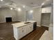 Well-lit kitchen offering granite counters, a stainless dishwasher, and seamless flow into the adjacent living area at 9254 Turkey Way, Middlesex, NC 27557