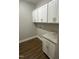 Functional laundry room featuring white cabinets, granite countertops, and ample storage space for household needs at 9254 Turkey Way, Middlesex, NC 27557