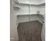 Spacious walk-in closet with carpet and wooden shelves, offering ample storage space for a modern home at 9254 Turkey Way, Middlesex, NC 27557