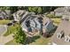 Aerial view of a two-story home with blue siding, solar panels, and fenced backyard at 94 Pearsall Farm Ln, Clayton, NC 27527