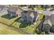 Aerial view of a fenced in backyard with firepit and outdoor kitchen at 94 Pearsall Farm Ln, Clayton, NC 27527