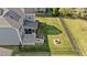 Spacious fenced backyard featuring an outdoor kitchen and stone fire pit at 94 Pearsall Farm Ln, Clayton, NC 27527