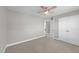 Bright bedroom featuring carpet, ceiling fan, and a spacious closet at 94 Pearsall Farm Ln, Clayton, NC 27527