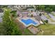 Aerial view features the community clubhouse with a pool, tennis courts, and playground at 94 Pearsall Farm Ln, Clayton, NC 27527