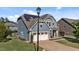Two-story home with solar panels, two-car garage and a cozy front patio with chairs at 94 Pearsall Farm Ln, Clayton, NC 27527