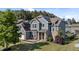 Beautiful two-story home with stone accents and a well-manicured lawn at 94 Pearsall Farm Ln, Clayton, NC 27527