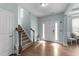 Inviting foyer with hardwood floors, staircase, and ample natural light at 94 Pearsall Farm Ln, Clayton, NC 27527
