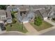 Inviting two-story home featuring a well-manicured lawn, solar panels and a two car garage at 94 Pearsall Farm Ln, Clayton, NC 27527