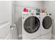 Modern laundry room featuring a large washer and dryer at 94 Pearsall Farm Ln, Clayton, NC 27527