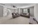 Spacious living room with comfortable seating, ceiling fan, and natural light at 94 Pearsall Farm Ln, Clayton, NC 27527