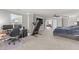 Spacious primary bedroom features a bed, home office, treadmill, and a large open layout at 94 Pearsall Farm Ln, Clayton, NC 27527