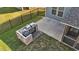 Overhead view of outdoor kitchen with built-in grill, concrete patio and string lights at 94 Pearsall Farm Ln, Clayton, NC 27527