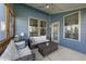 Relaxing patio with comfortable seating and ceiling fan at 94 Pearsall Farm Ln, Clayton, NC 27527