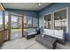 Relaxing screened porch with comfortable seating and outdoor furniture, perfect for enjoying the outdoors at 94 Pearsall Farm Ln, Clayton, NC 27527