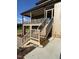 Spacious back porch with stairs leading to the backyard, providing an ideal outdoor living space at 976 Knob Hill Dr., Hillsborough, NC 27278