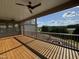 Covered back porch with ceiling fans and a view of the landscape at 976 Knob Hill Dr., Hillsborough, NC 27278