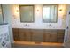 Bathroom featuring double sink vanity with bronze hardware and plenty of cabinet storage space at 976 Knob Hill Dr., Hillsborough, NC 27278