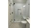 Bathroom with glass shower, patterned tile floor, and white subway tile at 976 Knob Hill Dr., Hillsborough, NC 27278