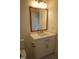 Bathroom features a white vanity with stone countertop, gold faucet and mirror trim, and tiled floors at 976 Knob Hill Dr., Hillsborough, NC 27278