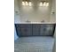 Bathroom vanity with double sinks, gray cabinets, and ornate tile flooring at 976 Knob Hill Dr., Hillsborough, NC 27278