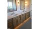 Bathroom featuring double sink vanity with bronze hardware and plenty of cabinet storage space at 976 Knob Hill Dr., Hillsborough, NC 27278