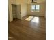Sunlit bedroom featuring wood floors and large windows at 976 Knob Hill Dr., Hillsborough, NC 27278