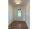 An empty bedroom with hardwood floors and a window at 976 Knob Hill Dr., Hillsborough, NC 27278