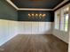 Elegant dining room with dark accent walls and gold light fixture at 976 Knob Hill Dr., Hillsborough, NC 27278