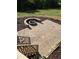 Outdoor patio with built-in stone fire pit and backyard views at 976 Knob Hill Dr., Hillsborough, NC 27278