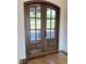 Elegant wood front doors with glass panels and stylish hardware at 976 Knob Hill Dr., Hillsborough, NC 27278
