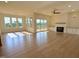 Spacious living room with hardwood floors, fireplace, and natural light at 976 Knob Hill Dr., Hillsborough, NC 27278