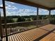 Covered porch showcasing outdoor views of trees, blue sky, and clouds at 976 Knob Hill Dr., Hillsborough, NC 27278