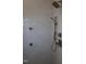Modern shower with brushed bronze hardware, adjustable shower head, and tiled walls at 976 Knob Hill Dr., Hillsborough, NC 27278