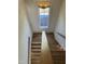 Top-down shot of staircase with wood steps and white risers at 976 Knob Hill Dr., Hillsborough, NC 27278
